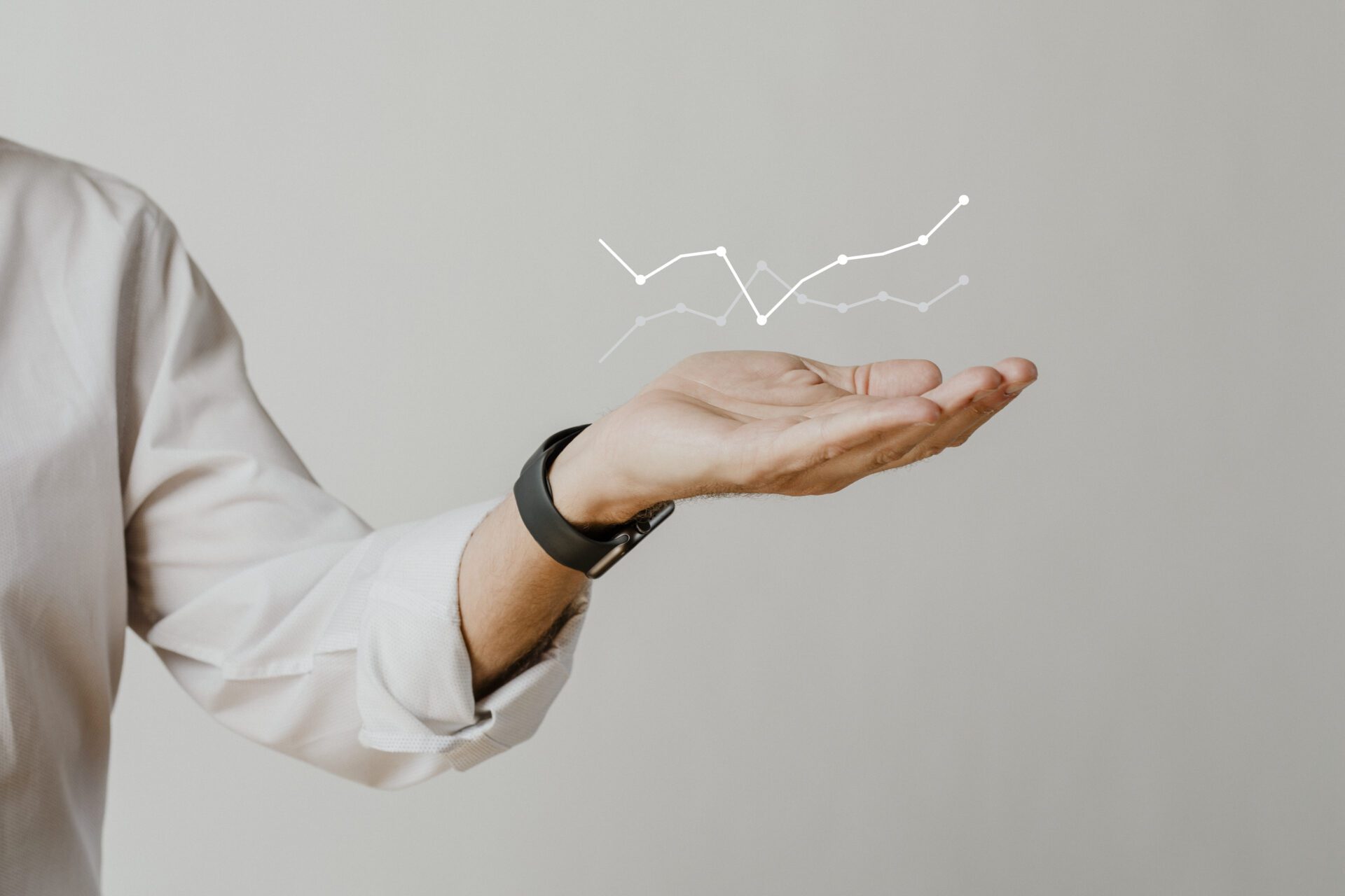 digital graph with businessman hand overlay